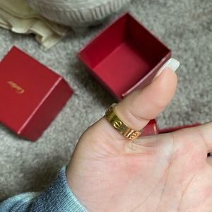 Cartier love band , the thicker one.